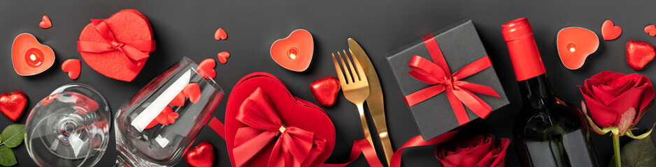 Beautiful romantic table setting on black background. Romantic dinner. Valentine's Day
