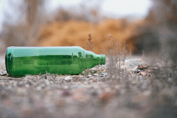 Beer bottle lying on the ground