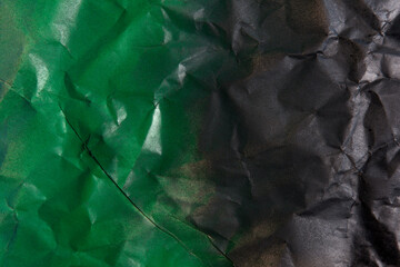 green color and black color on crumpled kraft paper
