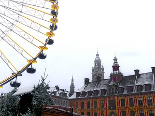 Lille, January 2024: Discover Lille, the capital of Flanders, under the snow. View of the big wheel at Lille's Village de Noel under the snow, seen from place du Général De Gaulle - Powered by Adobe