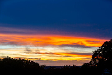 Fototapeta na wymiar Idyllic multicolored sky at dawn in a panoramic setting