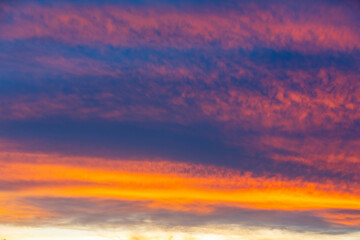 Naklejka na ściany i meble Idyllic multicolored sky at dawn in a panoramic setting