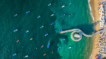 Aerial top down of Playa De Los Muertos beach and pier close to famous Puerto Vallarta Malecon, mexico riviera Nayarit