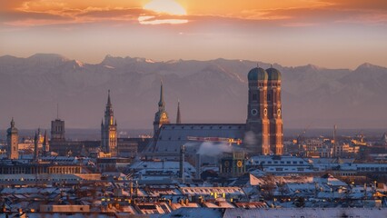 Munich city skyline aerial view, munich cathedral church frauenkirche marienplatz sqaure in background alps mountains. munich germany.