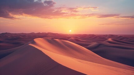  a sunset over a desert landscape with sand dunes in the foreground and a few clouds in the sky over the top of the sand dunes in the foreground. - obrazy, fototapety, plakaty