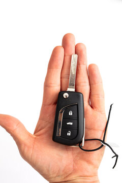 Car key on man hand isolated on white
