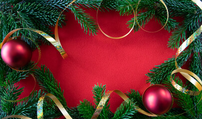 Fototapeta na wymiar Beautiful red background with branch of Christmas tree.