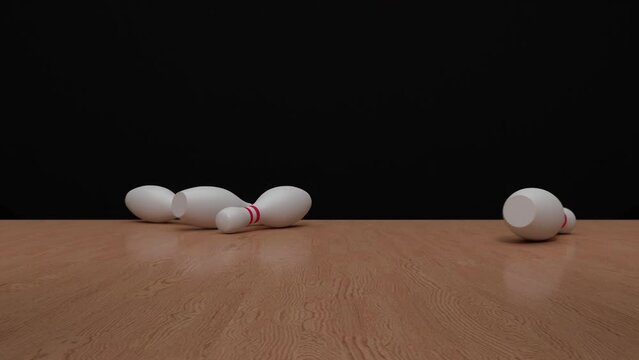The bowling ball travels down the bowling alley, hits and knocks down the bowling pins. Bowling strike. Concept of achieve goals and win.