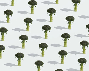 A seamless wallpaper pattern made of flowering broccoli heads standing upright on a white...