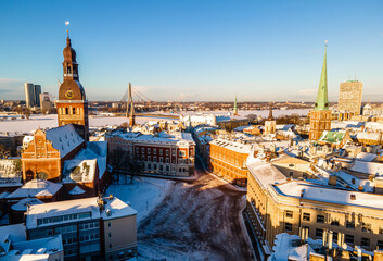 Fototapeta premium Aerial panorama view of Riga old town during beautiful winter day in Latvia. Freezing temperature in Latvia. White Riga.