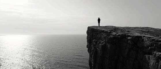 dramatic black and white image of a lone figure standing on a cliff overlooking the sea, reciting poetry to the vast ocean, symbolizing freedom and the power of words