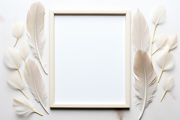 Empty white frame surrounded by white and grey feathers on a white background. Flat lay mockup photography for design and print