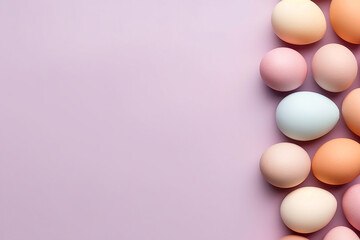 Various pastel-colored eggs aligned on a purple background