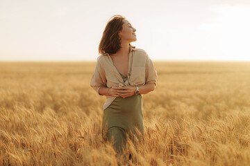 A tranquil moment as a woman stands in contemplation among the wheat, the golden hour's light...
