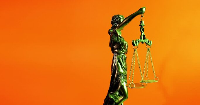 Lady Justice Against An Orange Background