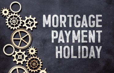 The sticker with the inscription MORTGAGE PAYMENT HOLIDAY is pinned to the board.