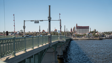 Fototapeta na wymiar The Bridge of Lions spans a river in Saint Augustine, Florida, on a clear winter day.