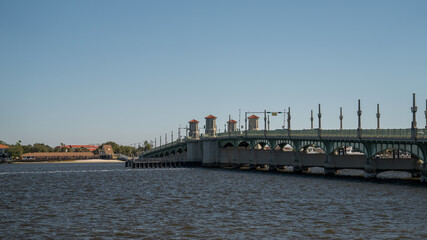 The Bridge of Lions spans a river in Saint Augustine, Florida, on a clear winter day.