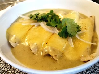 Green enchiladas with melted cheese and chicken 