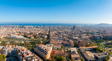 Aerial view of Barcelona City Skyline at sunset. Residential famous urban grid of Catalonia....