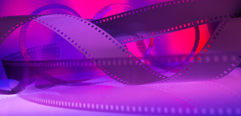 abstract multicolored background with film strip.film festival film production premiere announcement concept