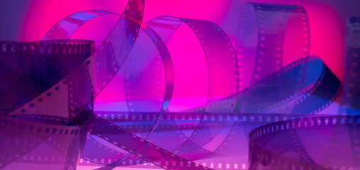 abstract multicolored background with film strip.film festival film production premiere announcement concept