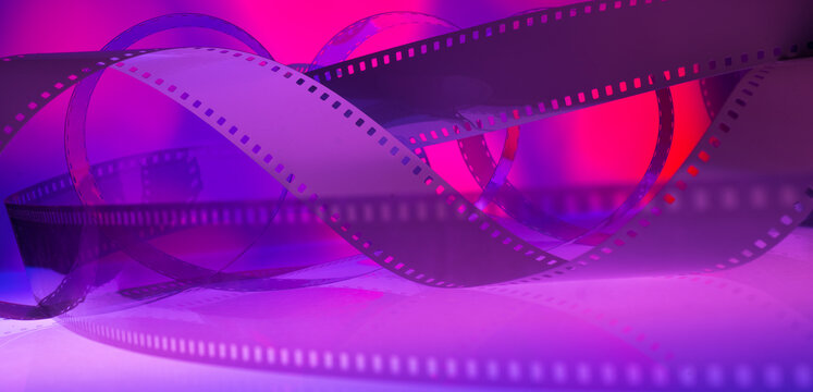 abstract multicolored background with film strip.film festival film production premiere announcement concept