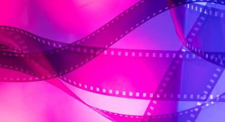 abstract multicolored background with film strip.film festival film production premiere announcement concept