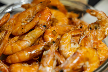 Close-up of grilled shrimp in a glass bowl