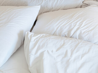 Fototapeta na wymiar white comfortable pillows on bed