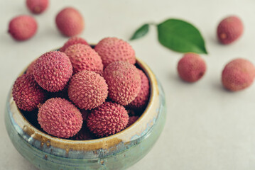 Fresh organic lychee fruit in bowl