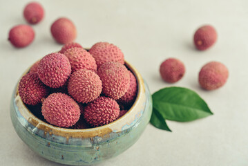 Fresh organic lychee fruit in bowl