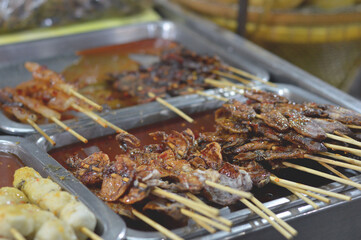 grilled pork and seafood on the street market, thailand