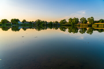 Lake in the village. Background with selective focus and copy space