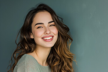 Fototapeta premium A woman with long hair is smiling for the camera