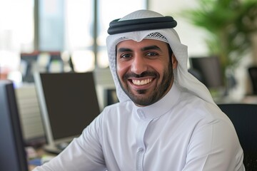 smiling emirati arab at office wearing kandura