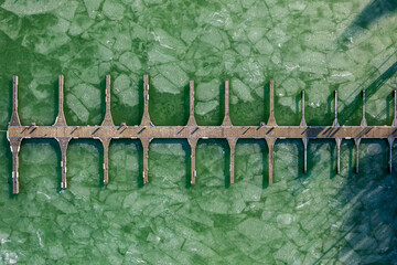 Aerial top down view about marina at Balatonlelle, Hungary. Ice floes on lake Balaton.