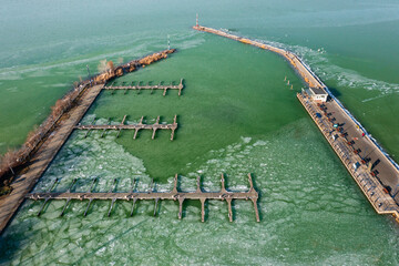Aerial view about marina at Balatonlelle, Hungary. Ice floes on lake Balaton.