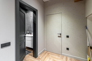 A black interior door ajar in a private house