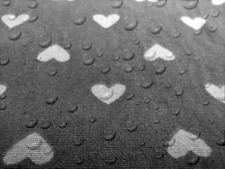 Fototapeta na wymiar hearts affect image. geometric seamless water drop pattern, with black background scattered shapes in love concept.
