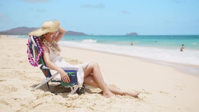 Happy tourist on Hawaii island coast. Joyful traveler on hawaiian ocean beach. Inspirational summer vacation holiday trip background. Young woman enjoying sea breeze. Wanderlust explorer Oahu island