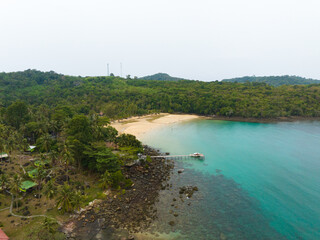 Aerial drone view of beautiful beach with turquoise sea water and palm trees of Gulf of Thailand. Kood island, Thailand.