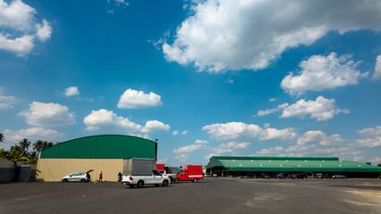 warehouse industry blue sky cloud white background car drive automatic industry factory shipping...