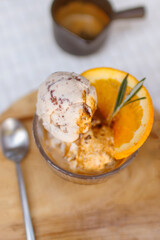 Affogato coffee: espresso shot with chocolate chip icecream on wooden table background.