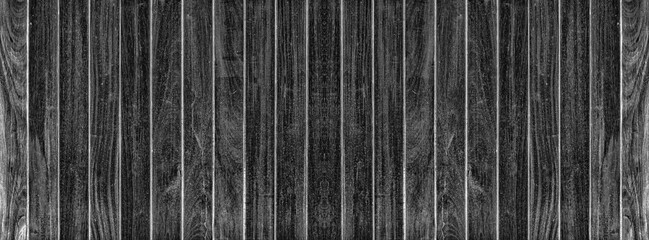Dark black color wood table for panorama wood background and texture.