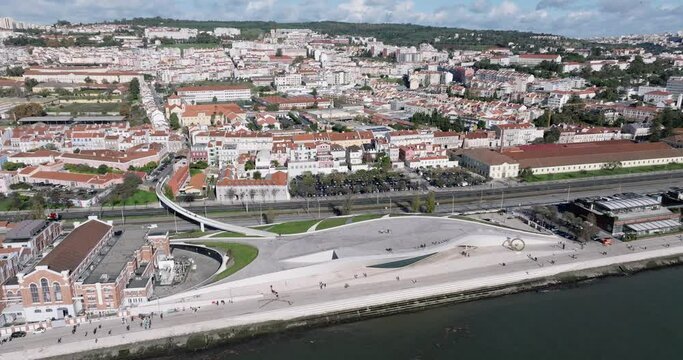 Aerial drone shot flying towards MAAT museum on the waterfront in Lisbon, Portugal, Europe. Shot in 5K ProRes 422 HQ