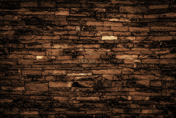Dark brown bricks wall for abstract brick background and bricks texture.