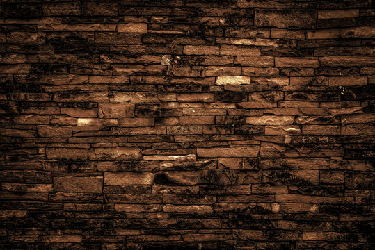 Dark brown bricks wall for abstract brick background and bricks texture.