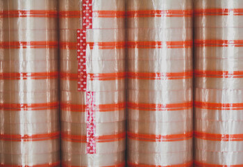 Red and white bamboo pattern on a textured mat background, creating a seamless gingham design with a touch of pink, ideal for textile, fashion, and art