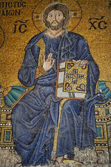 11th century  Byzantine mosaic features Christ Enthroned holding symbols of donations inside the Hagia Sophia,Istanbul, Turkey